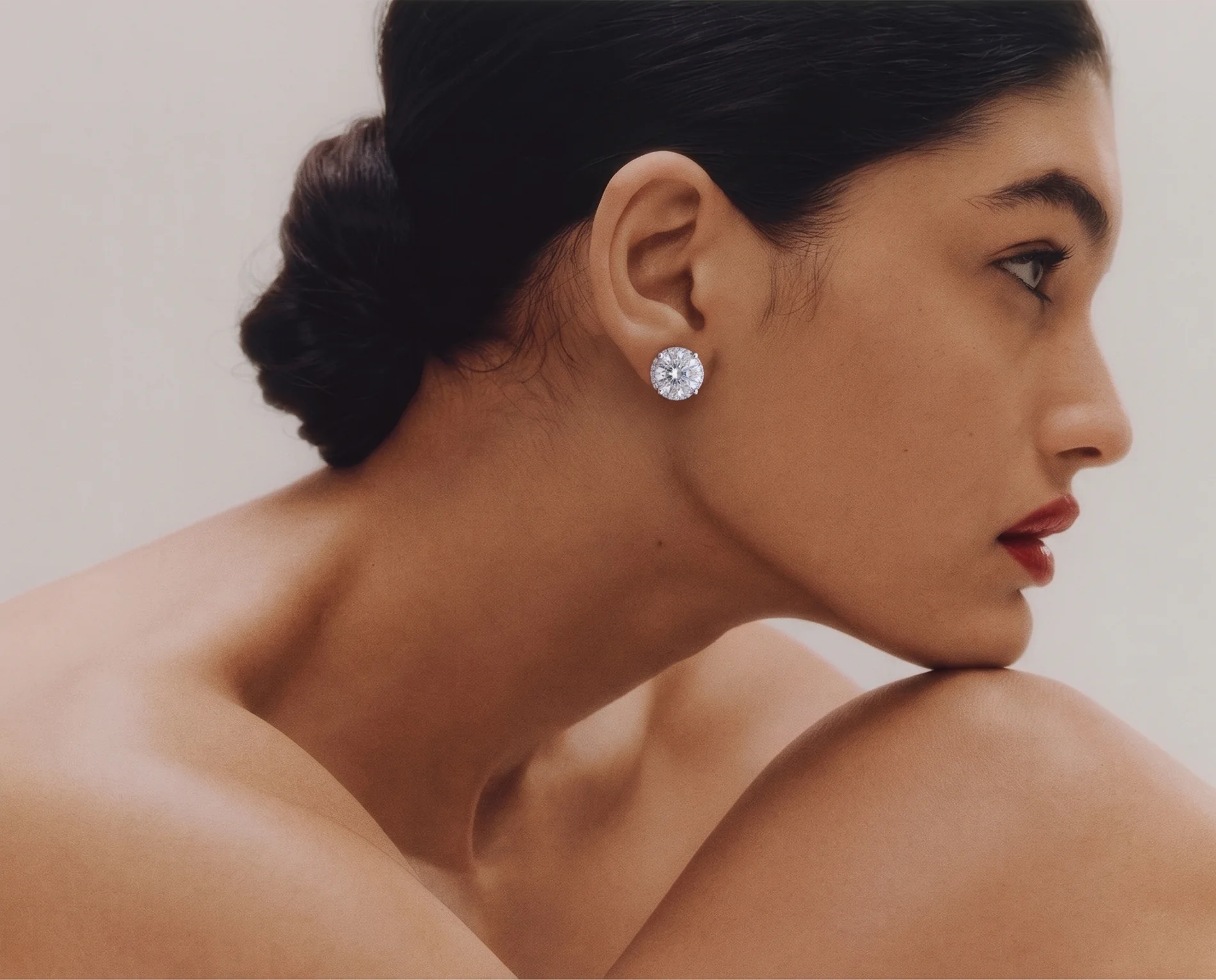 The companion diamond studs worn on the ear.