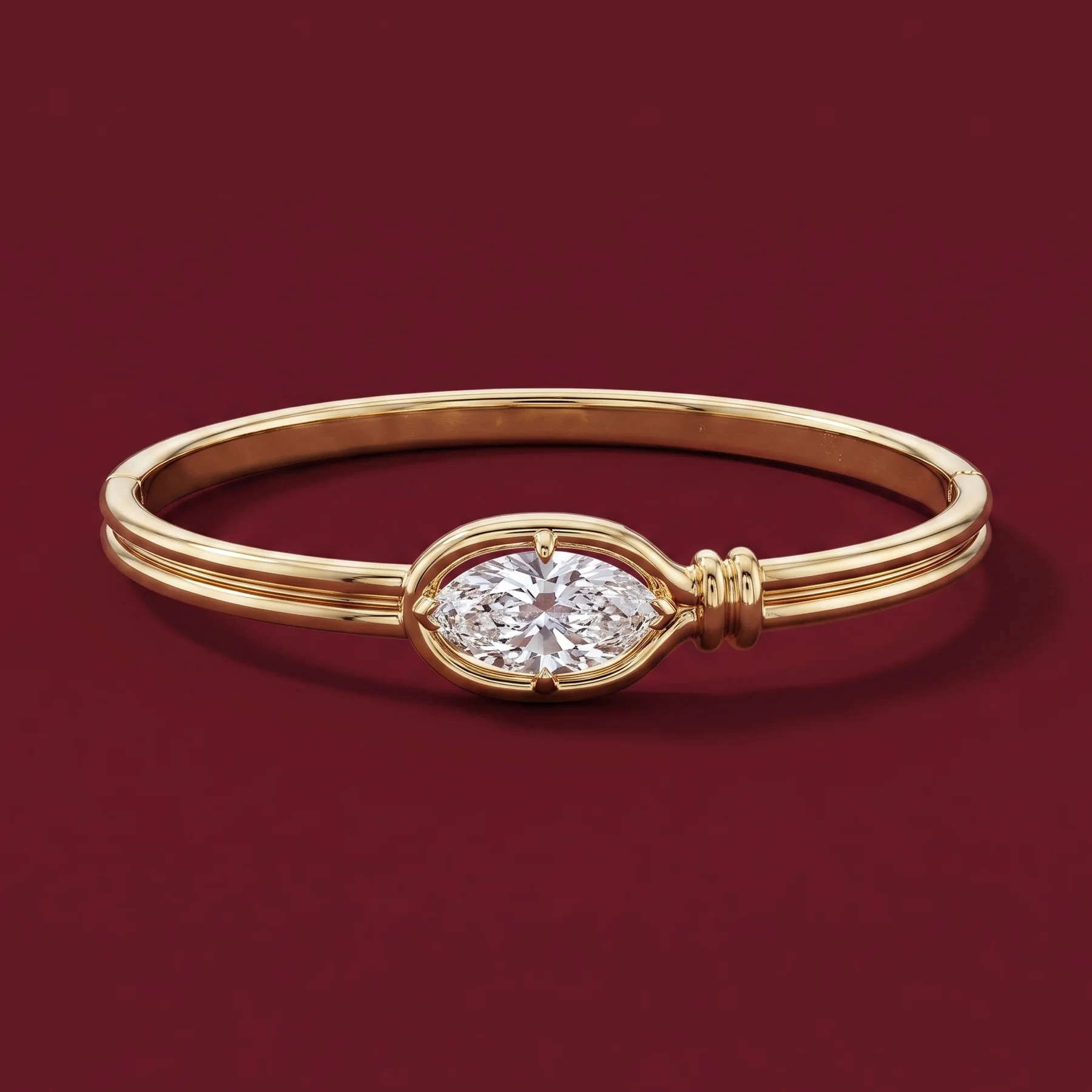 An oval warm-gold family bracelet with a diamond centre.