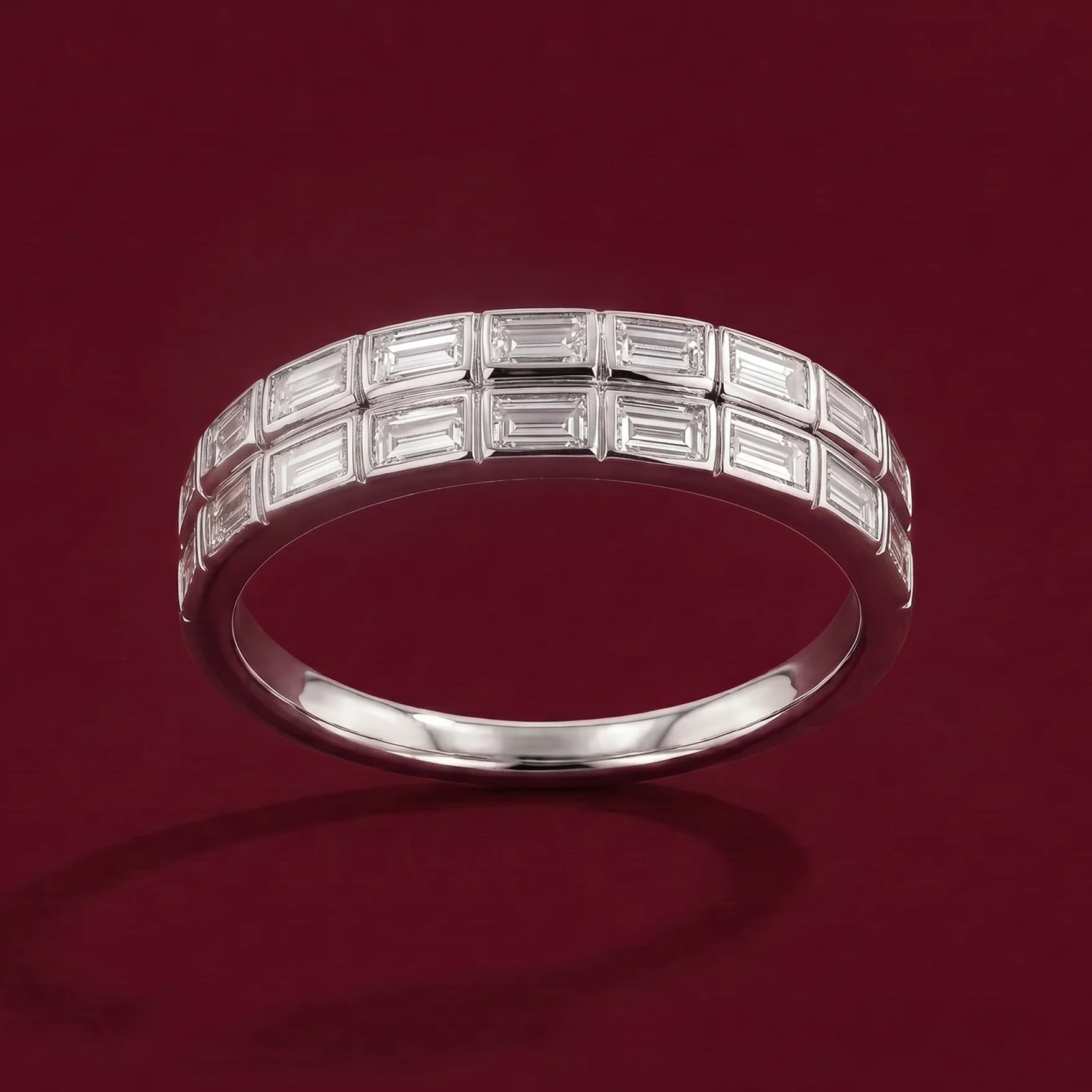 A slim diamond band for a love story on burgundy velvet.